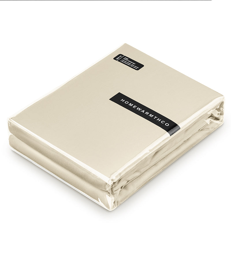 A set ofbeige duvet covers displayed on a white background coverd in a package