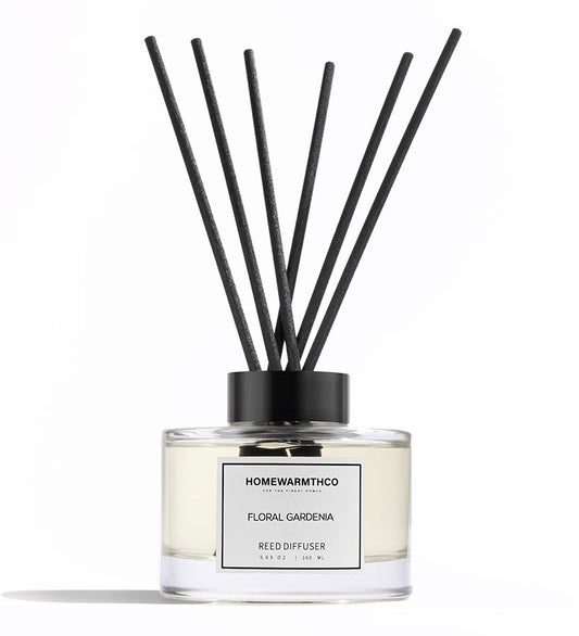 A luxury reed diffuser by HomeWarmthCo with floral gardenia fragrance