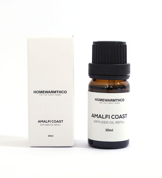 A small dark brown bottle with a black cap labeled 'Amalfi Coast Diffuser Oil
