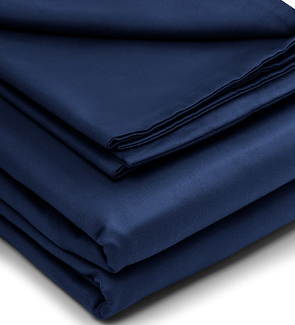 A set of navy and white patterned duvet cover folded at a white background