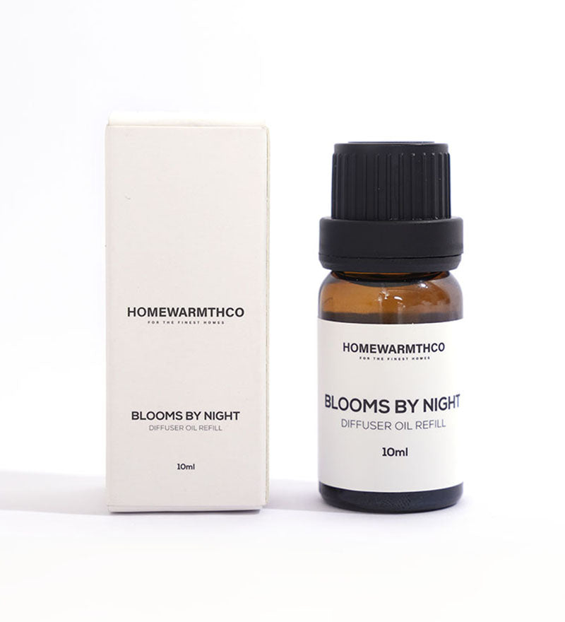 A 10ml bottle of 'Blooms by Night' diffuser oil with a white box