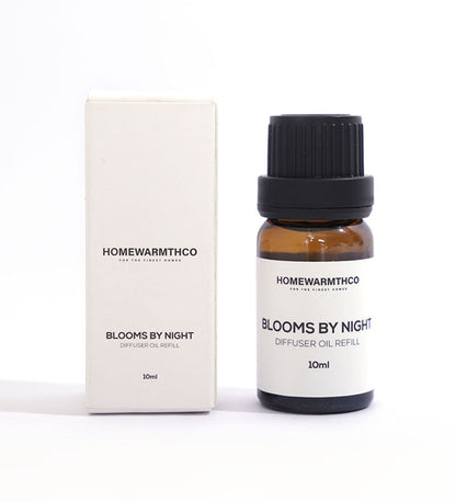 A 10ml bottle of 'Blooms by Night' diffuser oil with a white box