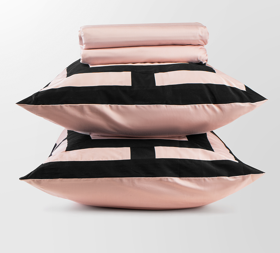 A bed with a duvet cover set in cocoa with black pattern