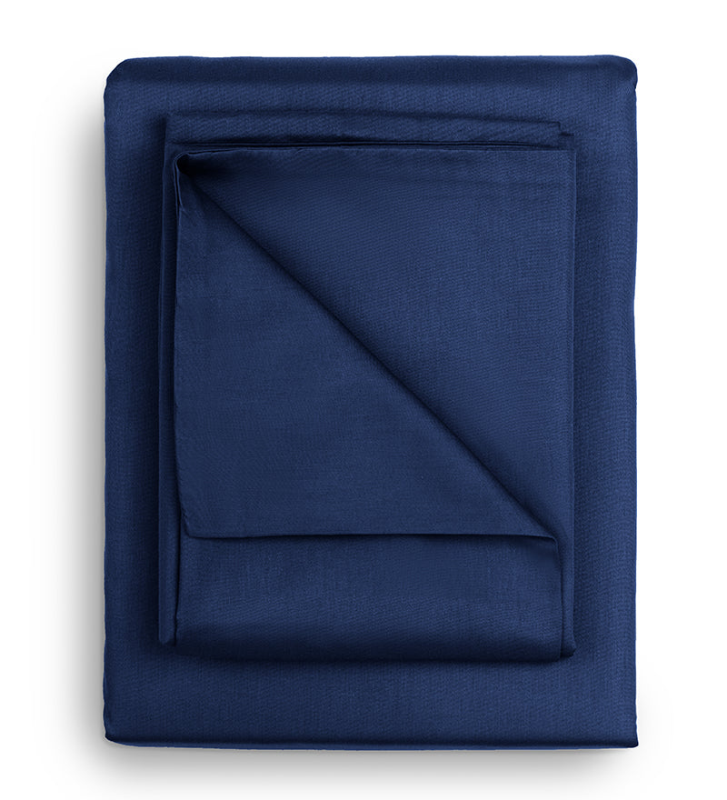 A set of blue duvet covers displayed on a white background