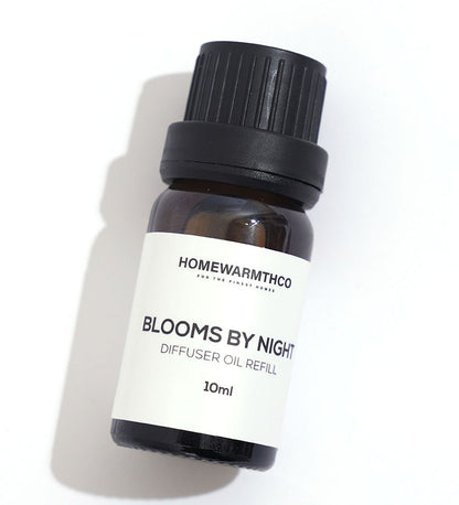 A 10ml bottle of 'Blooms by Night' diffuser oil with a white box