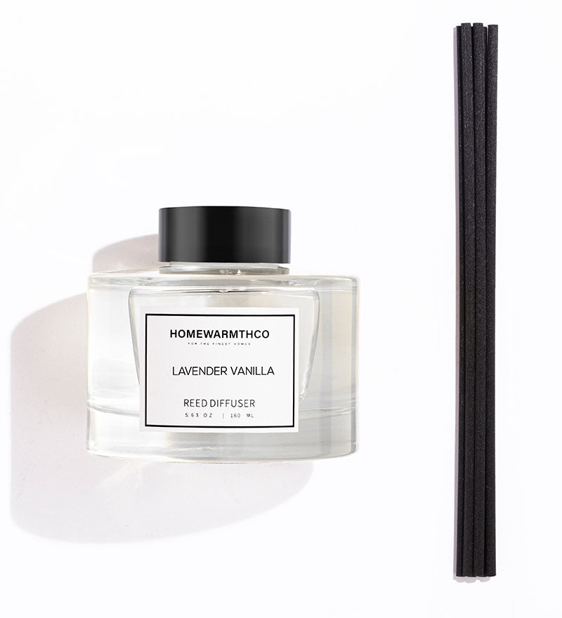 A luxury reed diffuser from HomeWarmthCo with black reeds 