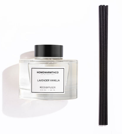 A luxury reed diffuser from HomeWarmthCo with black reeds 