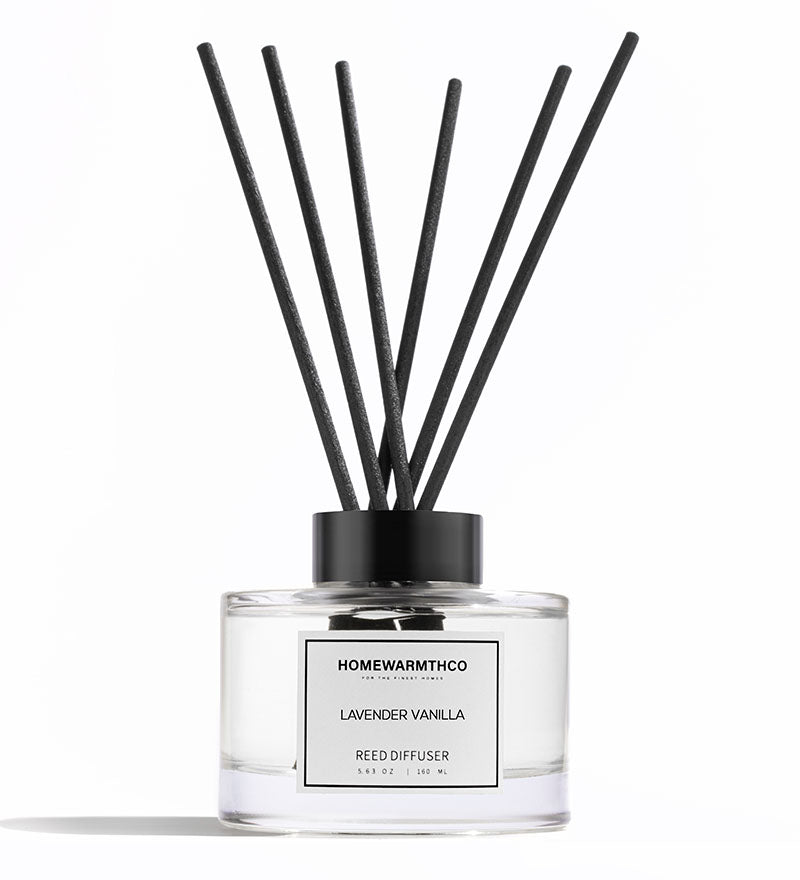 A luxury reed diffuser from HomeWarmthCo with black reeds 