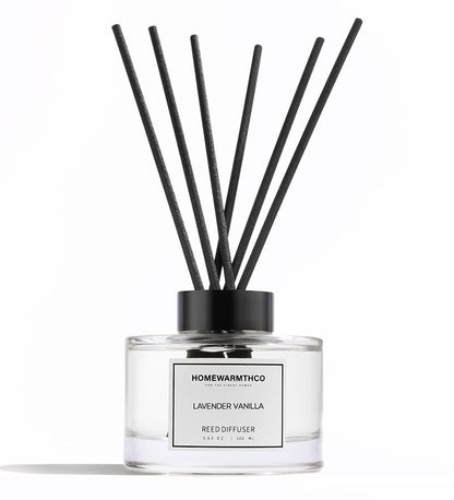 A luxury reed diffuser from HomeWarmthCo with black reeds 