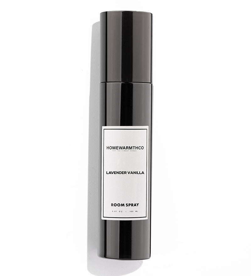 A black bottle of LAVENDER VANILLA room spray with a white label