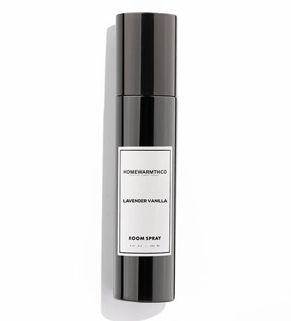 A black bottle of LAVENDER VANILLA room spray with a white label