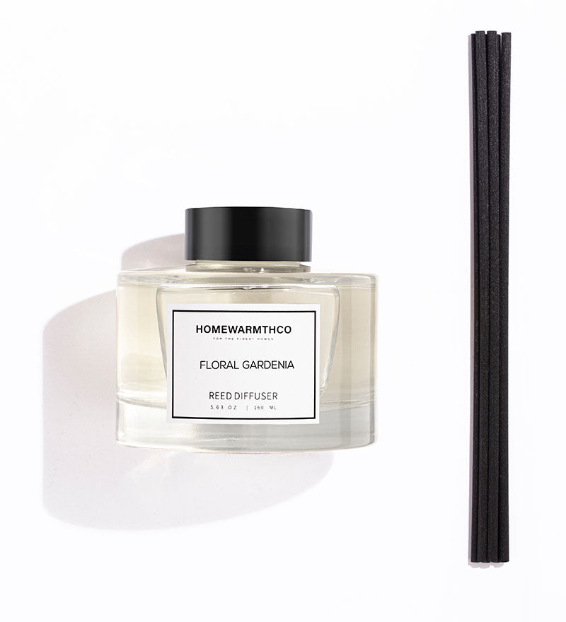 A luxury reed diffuser by HomeWarmthCo with floral gardenia fragrance