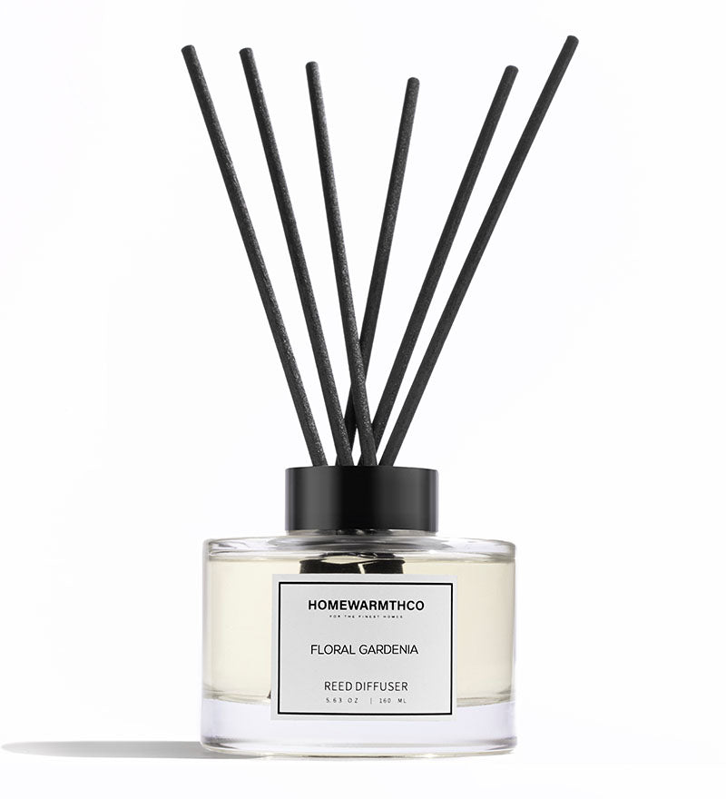 A luxury reed diffuser by HomeWarmthCo with floral gardenia fragrance