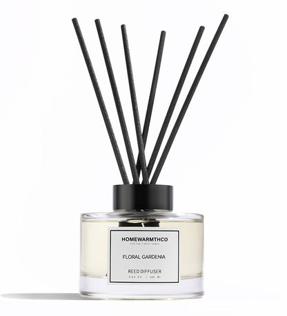 A luxury reed diffuser by HomeWarmthCo with floral gardenia fragrance