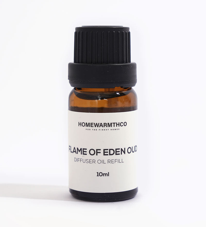 A small dark-colored bottle labeled 'Flame of Eden Oud Diffuser Oil' with a capacity of 10ml.