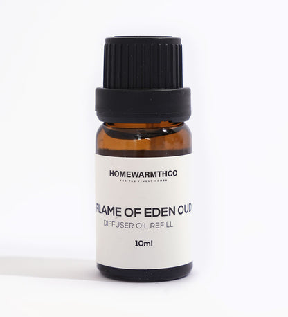 A small dark-colored bottle labeled 'Flame of Eden Oud Diffuser Oil' with a capacity of 10ml.