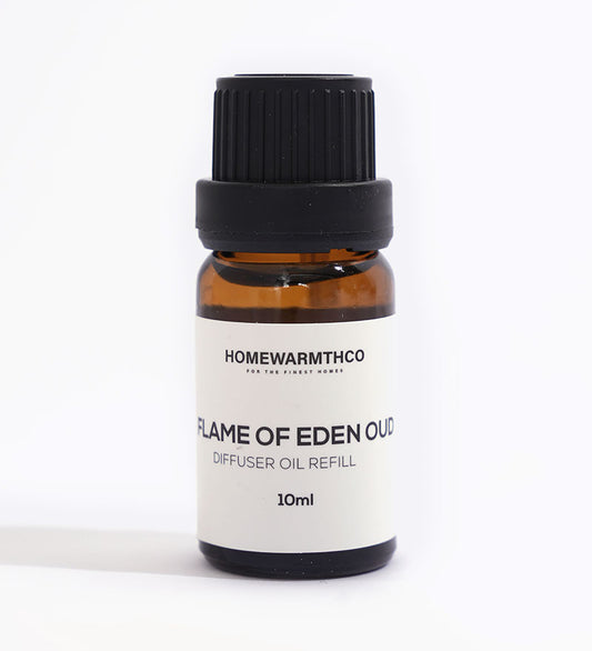 A small dark-colored bottle labeled 'Flame of Eden Oud Diffuser Oil' with a capacity of 10ml.