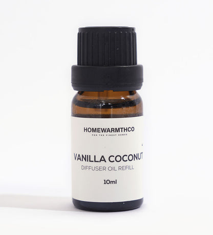 A small dark-colored bottle labeled 'VANILLA COCONUT' indicates it is a diffuser essential oil.