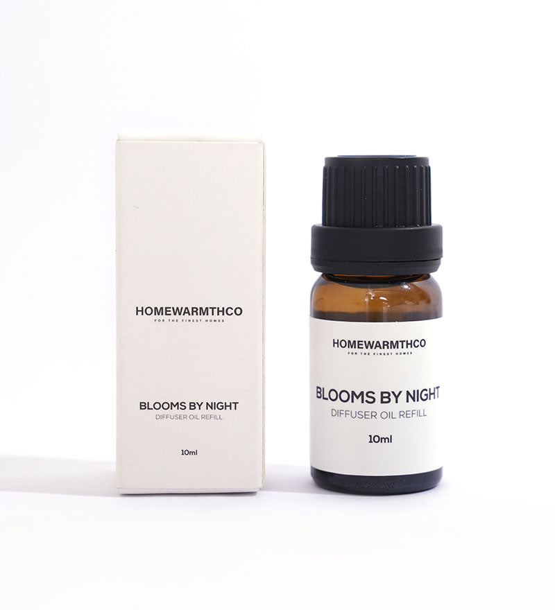 A 10ml bottle of 'Blooms by Night' diffuser oil with a white box