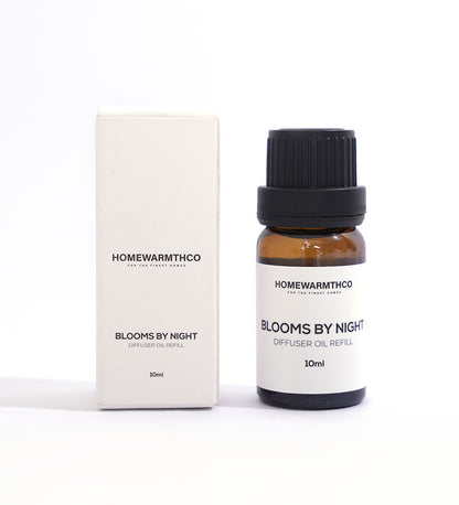 A 10ml bottle of 'Blooms by Night' diffuser oil with a white box