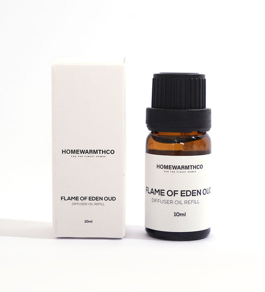 A small dark-colored bottle labeled 'Flame of Eden Oud Diffuser Oil'