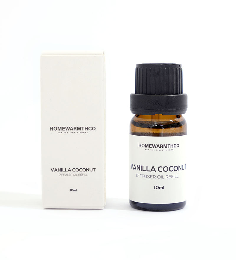 A small dark-colored bottle labeled 'VANILLA COCONUT'