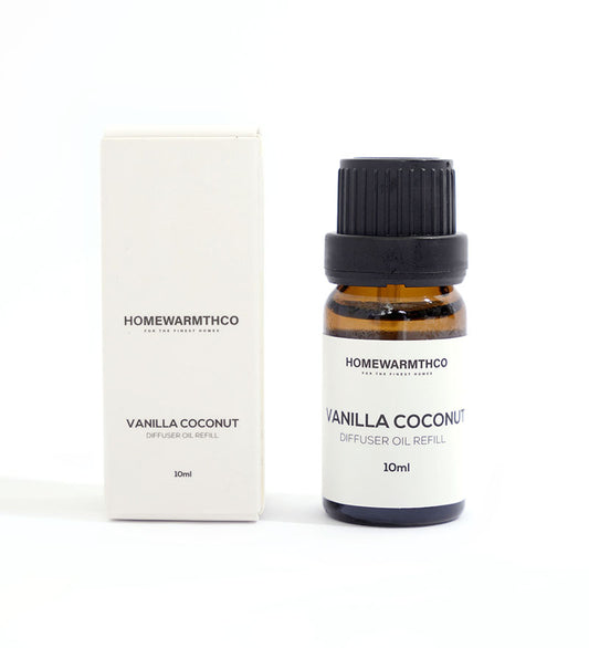 A small dark-colored bottle labeled 'VANILLA COCONUT'