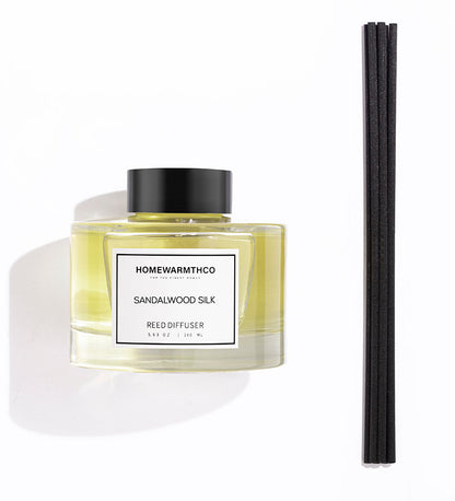 A luxury reed diffuser from HomeWarmthCo with sandalwood silk fragrance